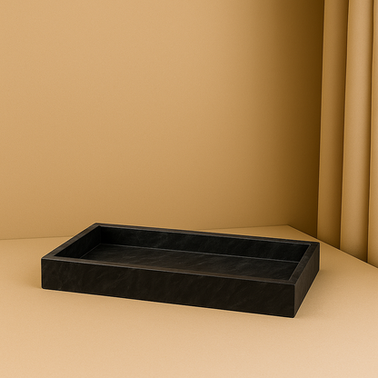 black marble tray standing in beige golden background 