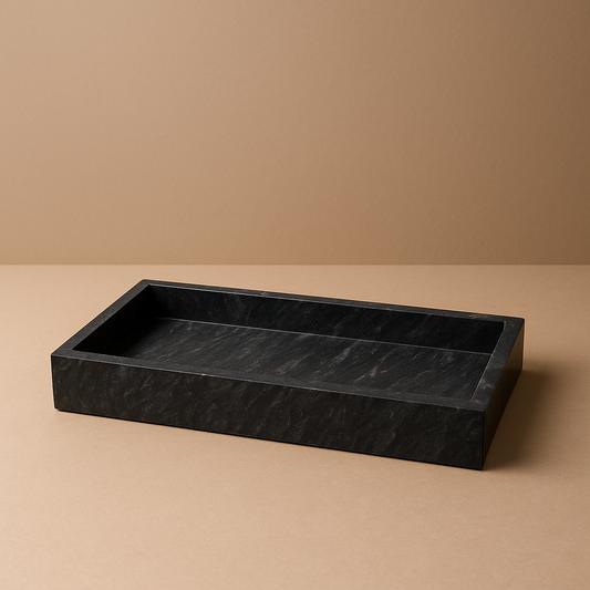 black marble tray standing on beige surface 